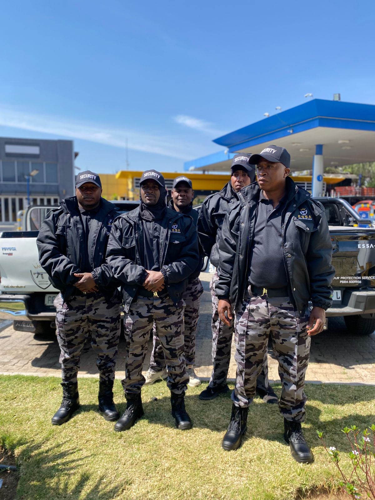 ESSA security team standing in front of branded response vehicles